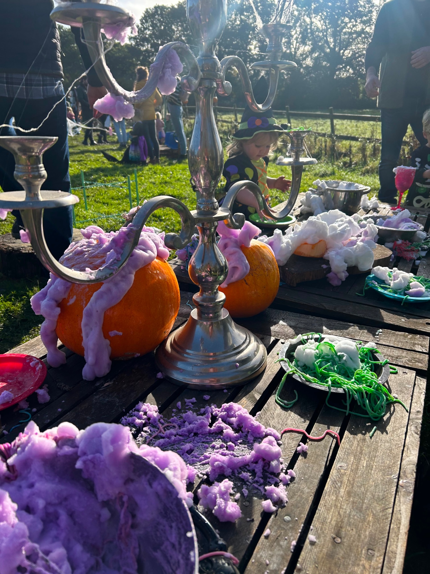 Bubbling potion foam spilling over pumpkins